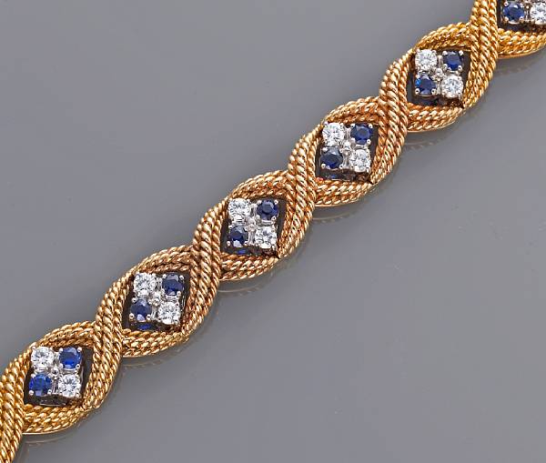 Appraisal: A diamond and sapphire bracelet with articulated center links estimated