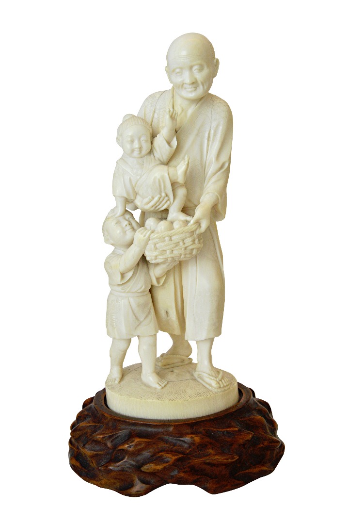 Appraisal: A Japanese ivory okimono Meiji period carved as a man