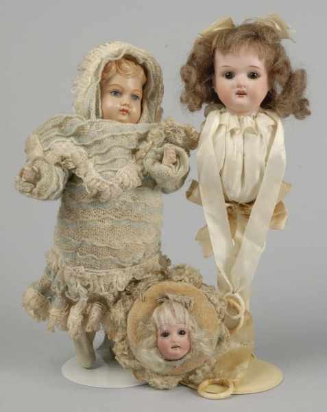 Appraisal: Lot of Antique Doll Novelties Description Musical doll toy with