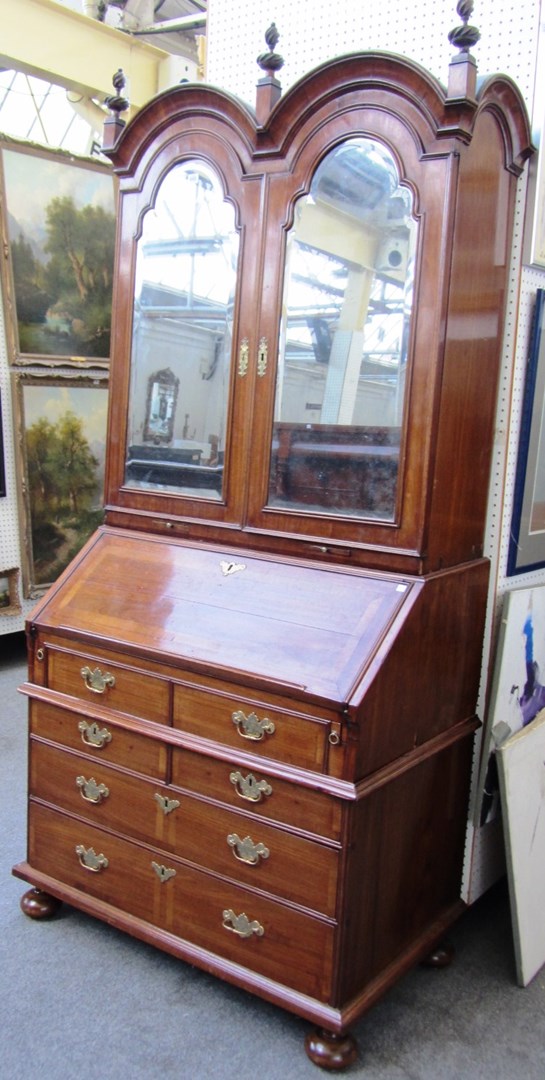 Appraisal: A mid th century walnut and mahogany bureau bookcase the