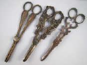 Appraisal: Three pairs of silver plated grape scissors one naturalistic with