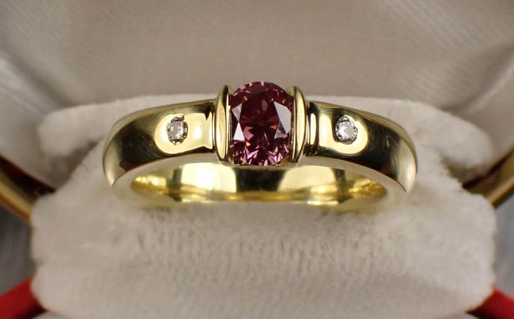 Appraisal: PURPLISH PINK DIAMOND AND EIGHTEEN KARAT GOLD RING with copy