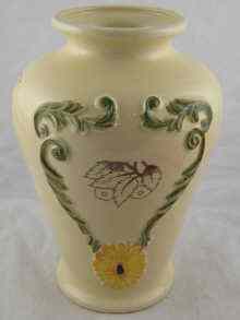 Appraisal: A ceramic vase with raised decoration on the cream ground