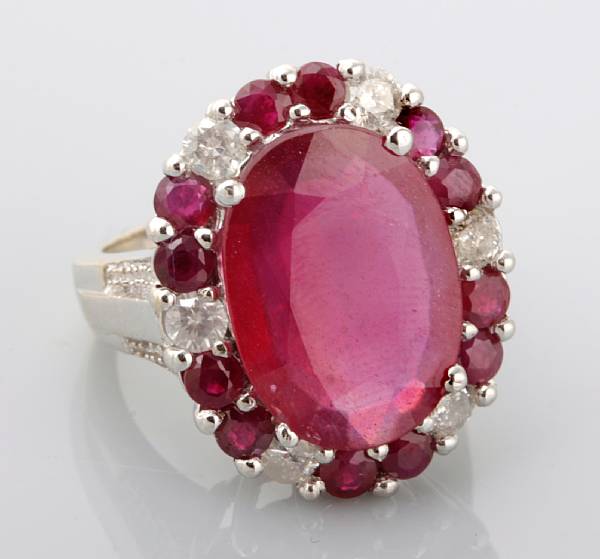 Appraisal: property of various owners centering a large oval ruby with