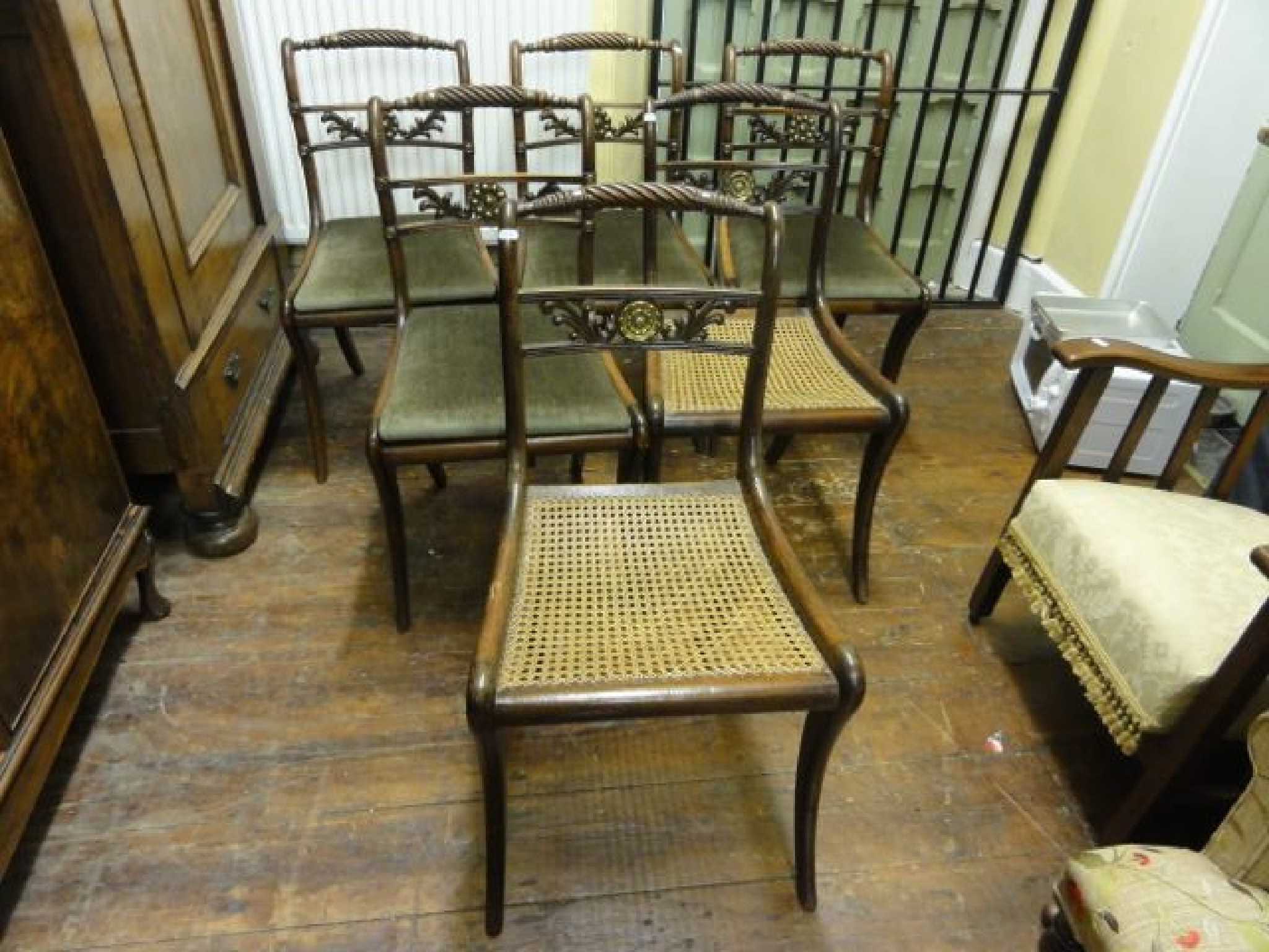 Appraisal: A matched set of six Regency sabre leg dining chairs