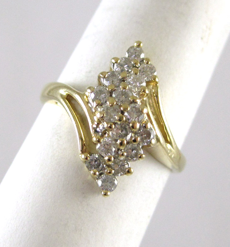 Appraisal: DIAMOND AND FOURTEEN KARAT GOLD RING set with round-cut diamonds