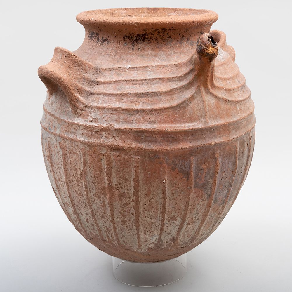 Appraisal: West African Buff Pottery Storage Jar With a spout three