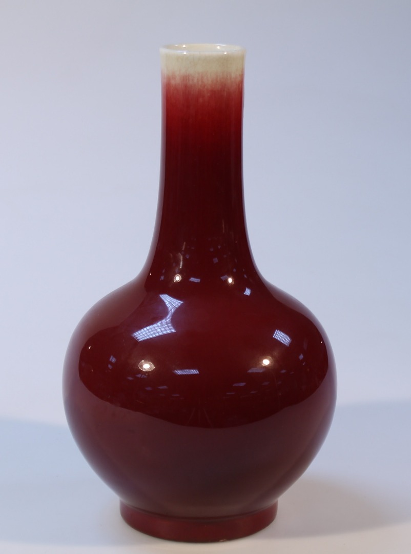 Appraisal: A Chinese sang de boeuf vase with cylindrical stem and