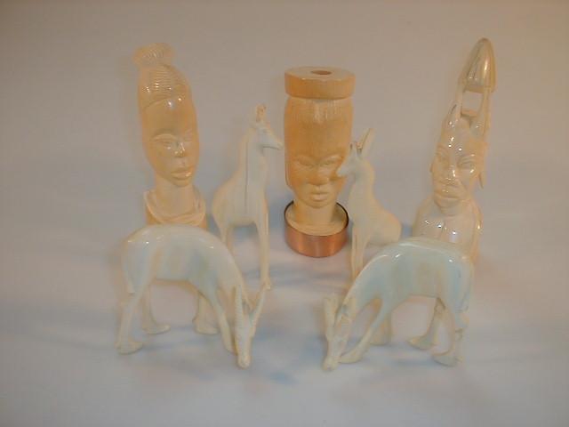 Appraisal: A group of ivory carvings including native heads gazelles -