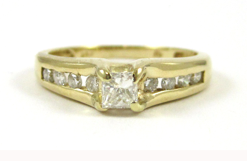 Appraisal: DIAMOND AND FOURTEEN KARAT GOLD RING with four round-cut diamonds