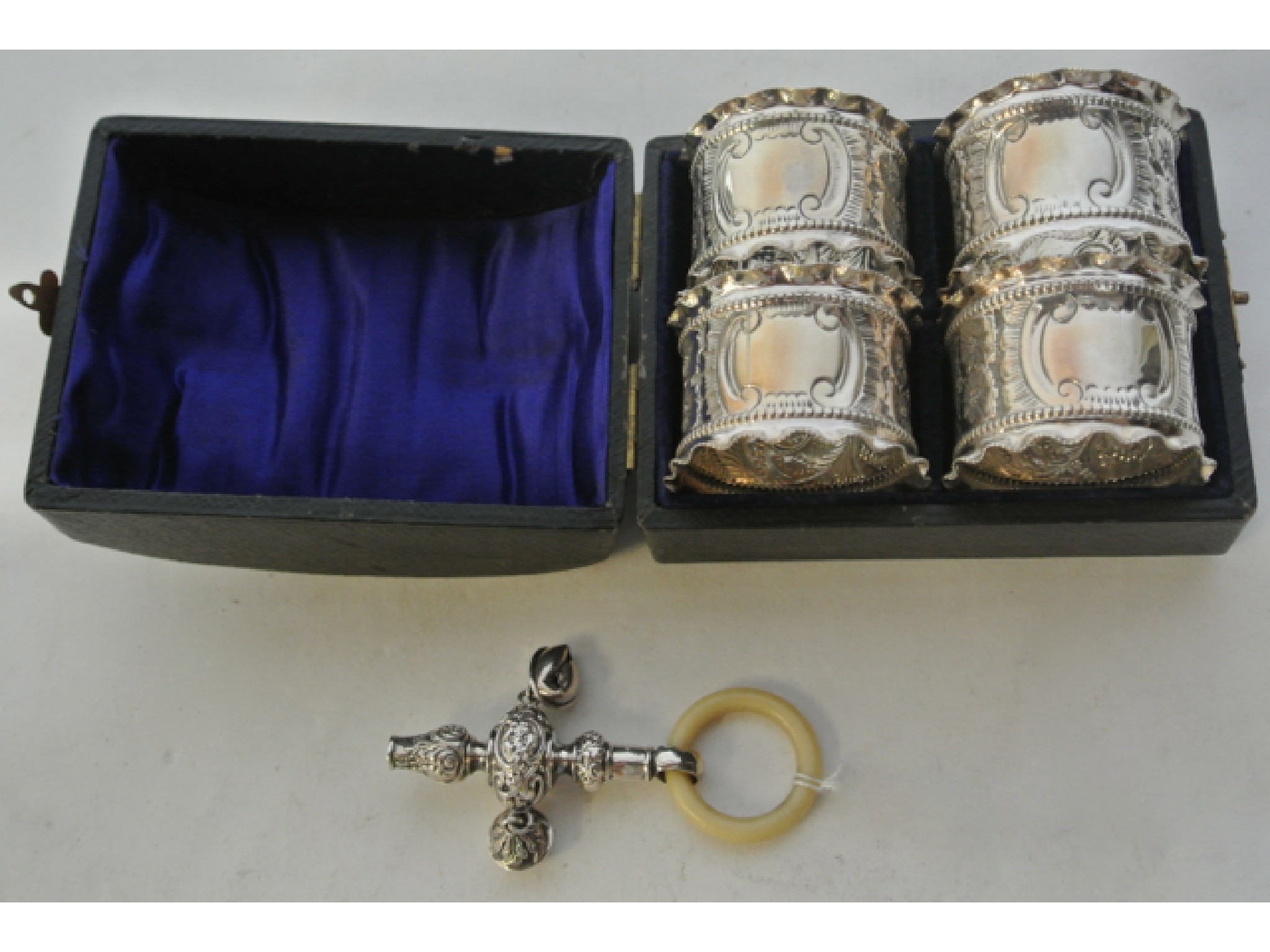 Appraisal: An Edwardian silver baby rattle Crisford Norris Ltd Birmingham attached