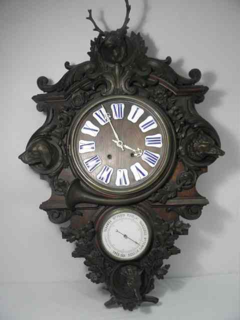 Appraisal: German figural cast iron and bronze wall clock with barometer