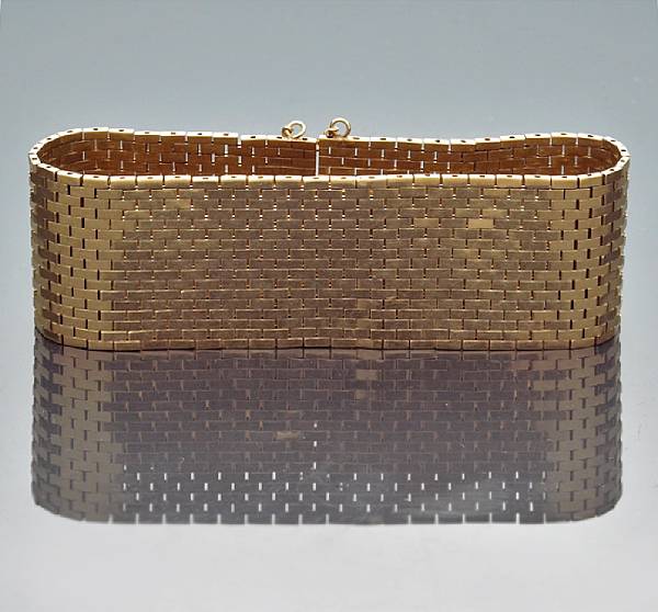 Appraisal: A fourteen karat gold and diamond-set wide bracelet weighing approximately