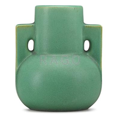 Appraisal: TECO Buttressed vase matte green glaze with charcoaling Terra Cotta