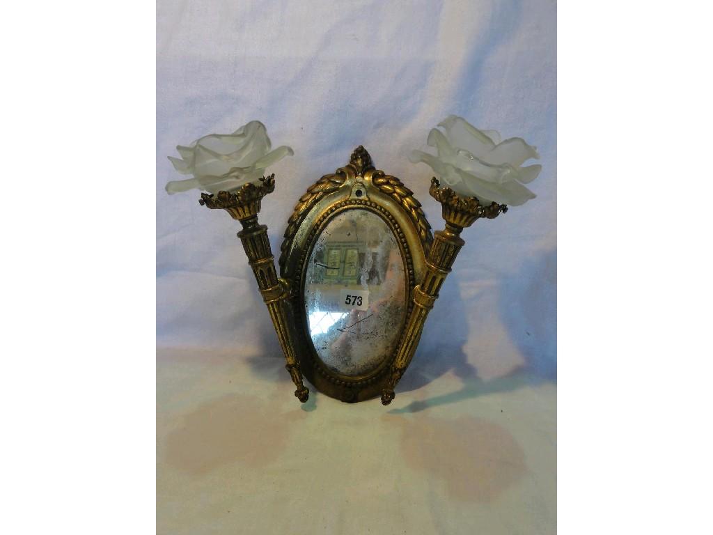 Appraisal: A pair of French bronze ormolu girandole with oval mirrored