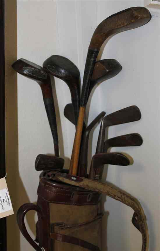 Appraisal: A collection of golf clubs c - comprising a F