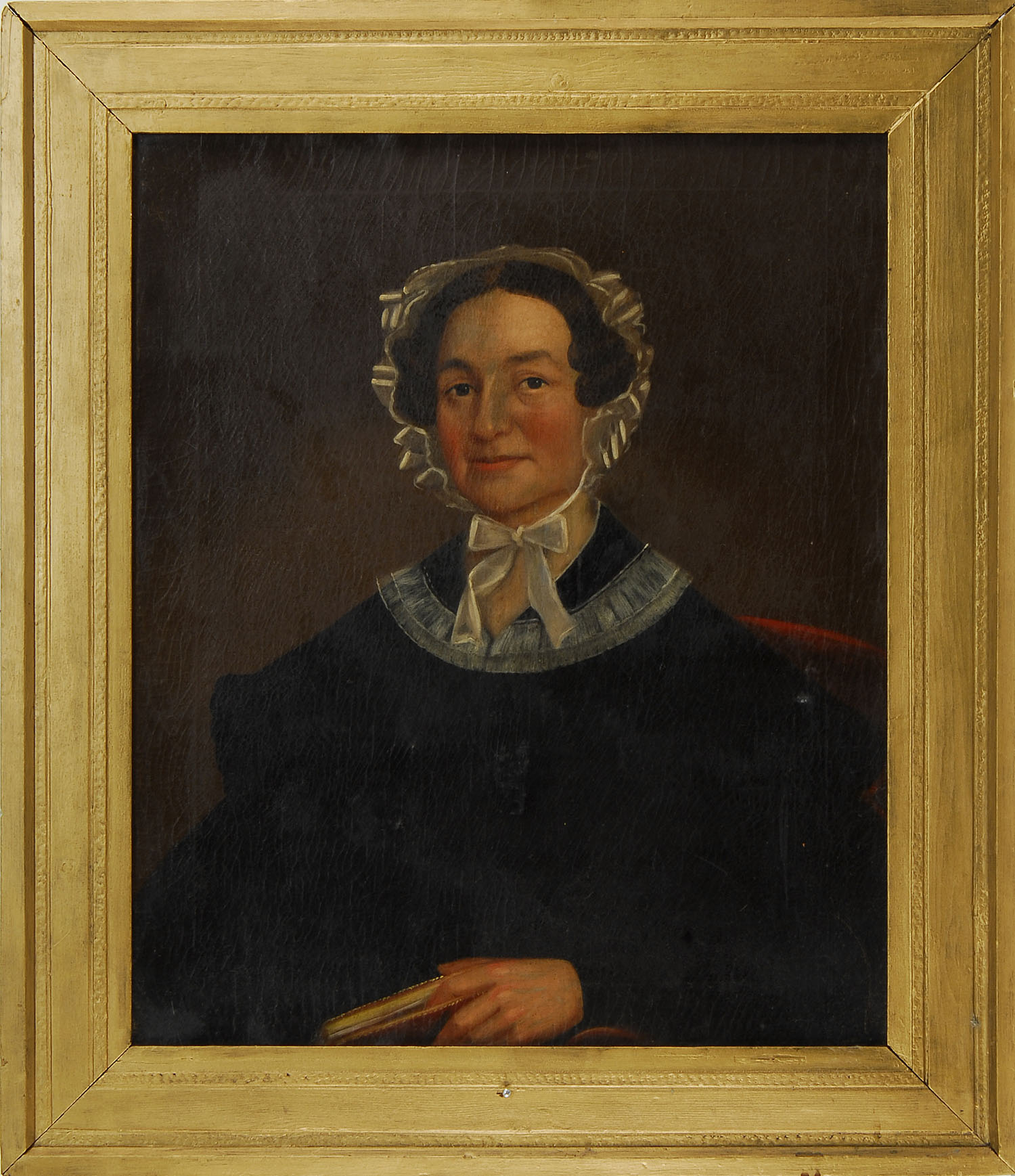 Appraisal: FRAMED PORTRAIT American th CenturyA woman holding a book while