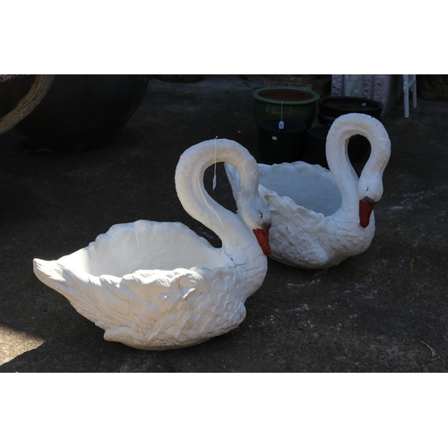 Appraisal: Pair of white painted composite stone garden swans approx cm