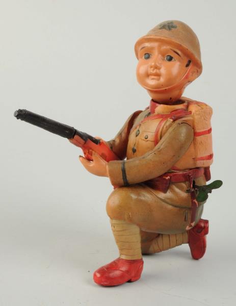 Appraisal: Pre-War Japanese Celluloid Wind-Up Soldier Toy Holding original two-piece rifle