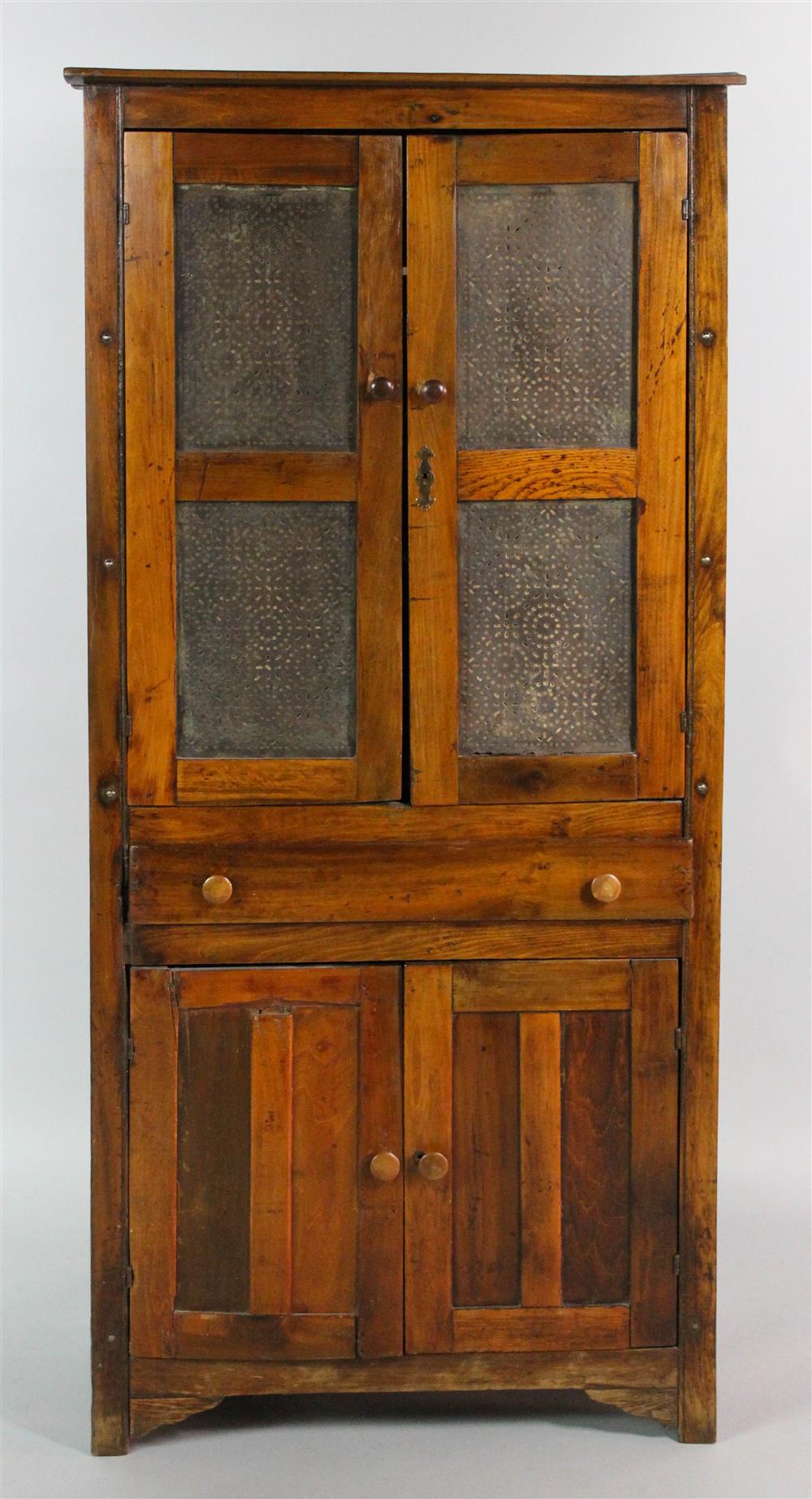 Appraisal: AMERICAN COUNTRY MIXED WOOD CUPBOARD having a rectangular top over