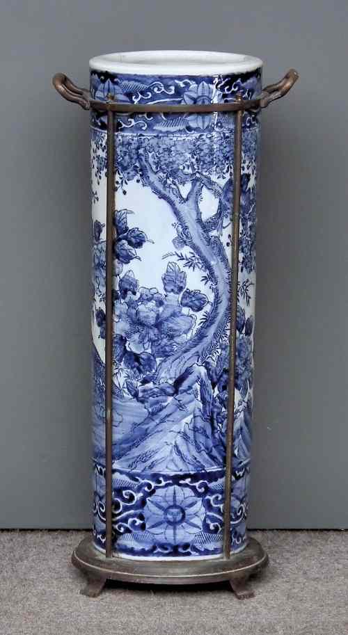 Appraisal: A Japanese blue and white porcelain cylindrical umbrella stand decorated