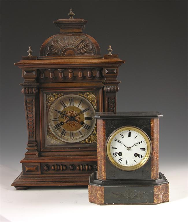 Appraisal: A late th century carved walnut mantel clock