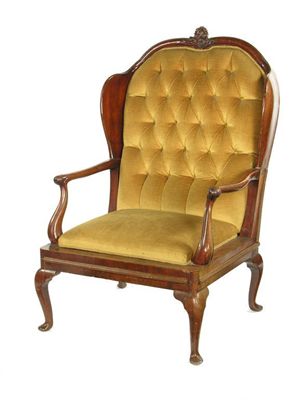 Appraisal: An th century Dutch mahogany wing armchair the later button