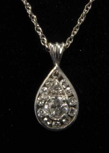 Appraisal: K W Gold Diamond Necklace Description Diamonds ct center stone