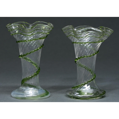 Appraisal: A pair of Edwardian clear and green trailed spirally fluted