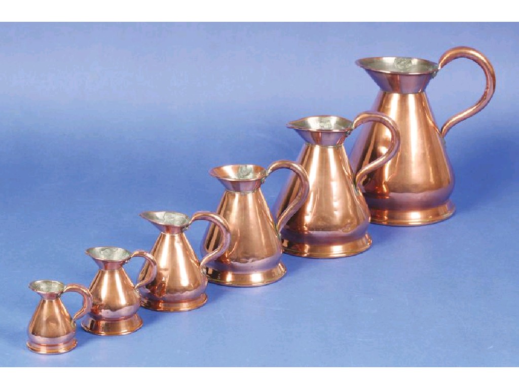 Appraisal: A GRADUATED MIXED SET OF EIGHT VICTORIAN COPPER HAYSTACK MEASURES