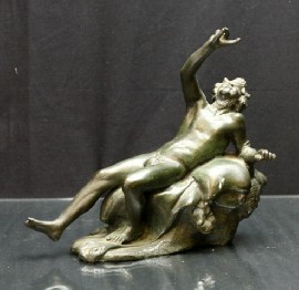 Appraisal: A bronze figure of a reclining Satyr after the antique