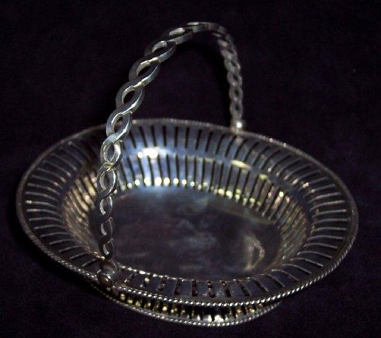 Appraisal: A George II oval basket with pierced border and swing