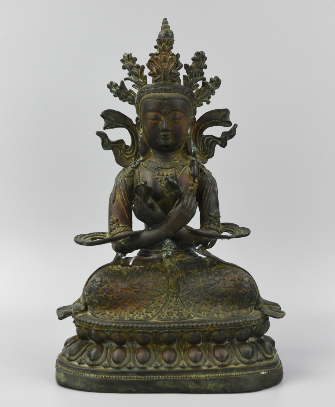 Appraisal: CHINESE SEATED CROWNED BRONZE BUDDHA QING D A Chinese seated