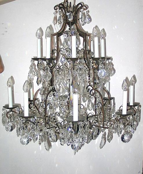 Appraisal: A Rococo style gilt metal and glass sixteen-light chandelier Mid-