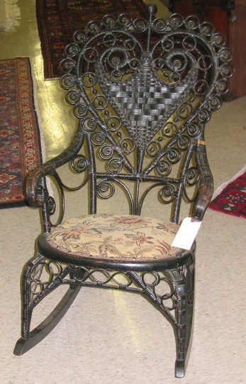 Appraisal: A VICTORIAN HEART-BACK WICKER ROCKER American c of hand woven