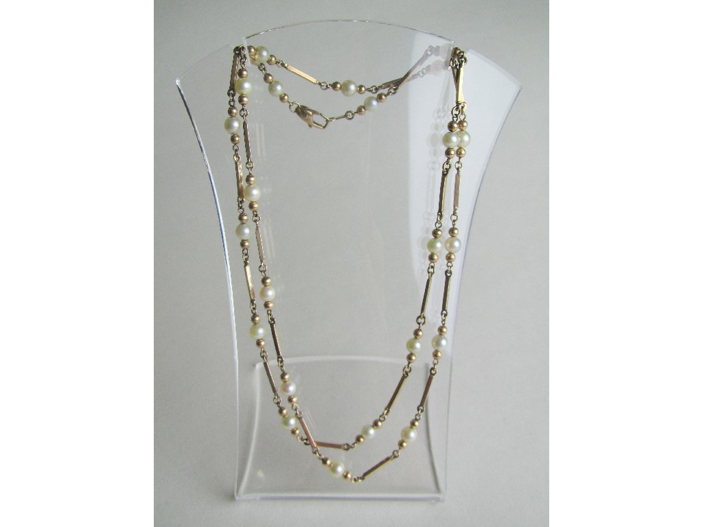 Appraisal: Nine carat gold pearl spacer necklace Approximately inches