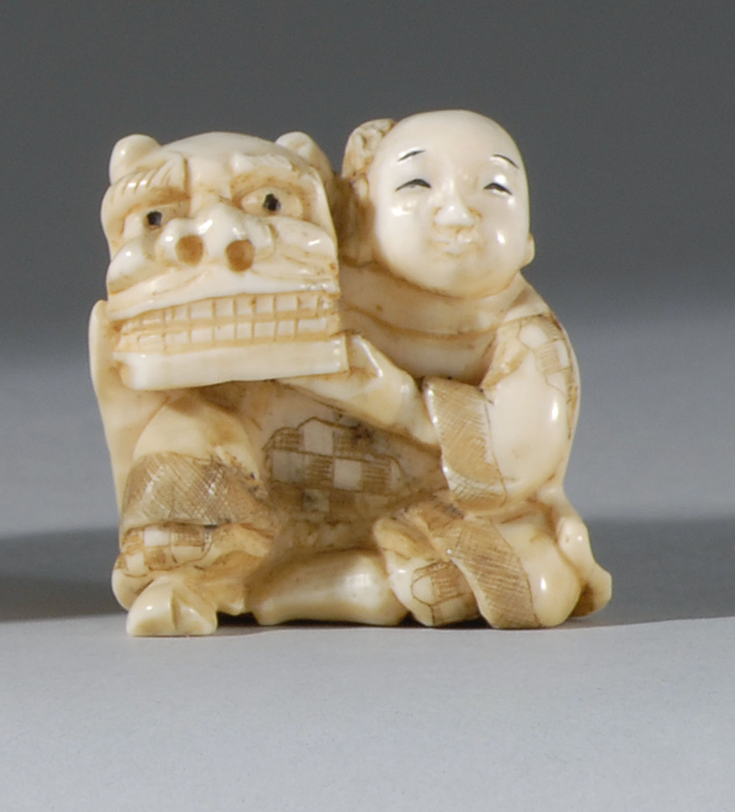 Appraisal: IVORY NETSUKE Late Meiji PeriodIn the form of a karako