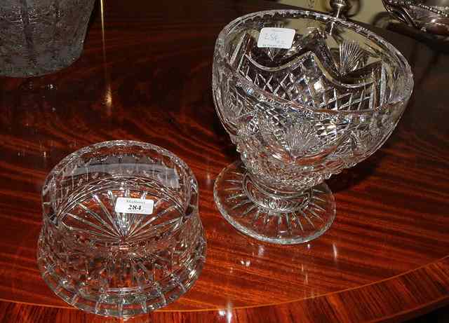 Appraisal: A CUT GLASS WINE COASTER with spreading foot together with