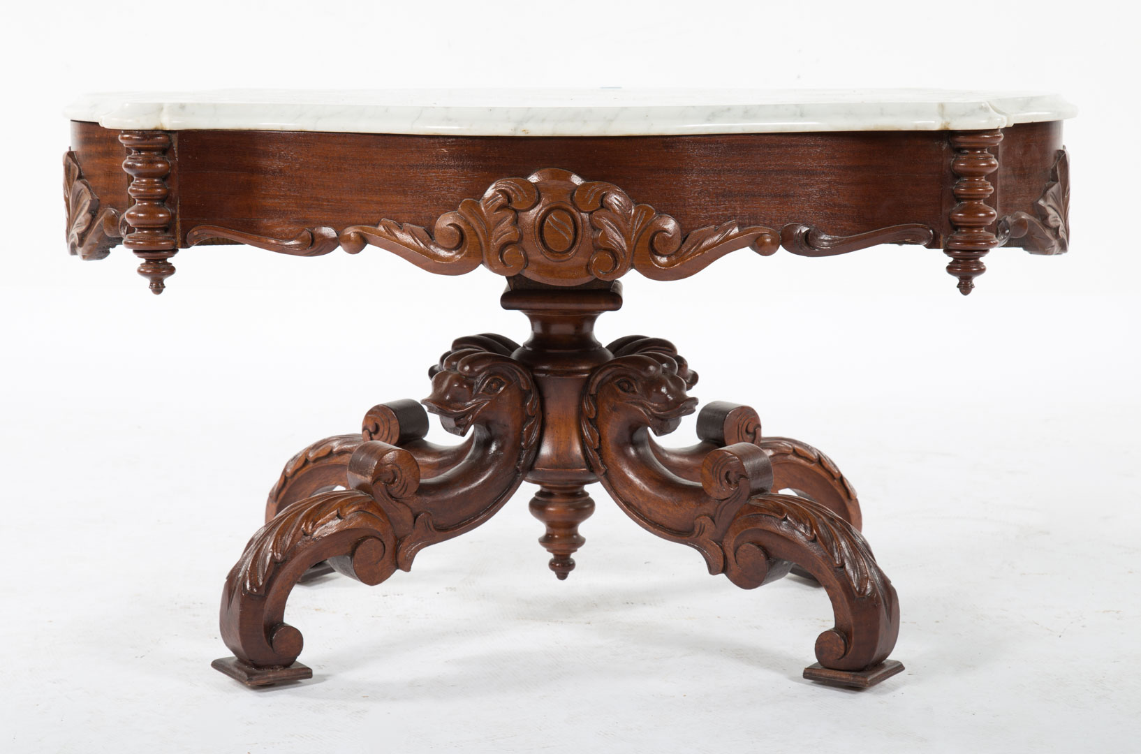 Appraisal: Elizabethan Revival mahogany coffee table mid- th century shaped variegated