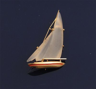 Appraisal: A gold yacht brooch The sails formed as carved frosted