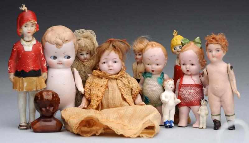 Appraisal: Lot of All-Bisque German Dolls Slender glass-eyed boy painted-eye girl