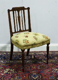 Appraisal: A George III style mahogany and upholstered occasional chair