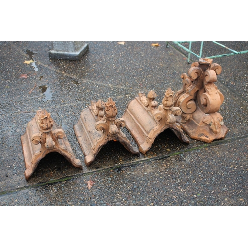 Appraisal: Four antique th century French terracotta Gothic room capping finials