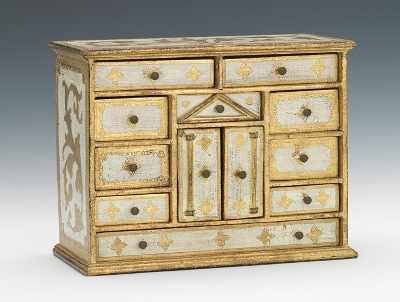 Appraisal: An Italian Miniature Chest of Drawers Florentined gilt and antiqued