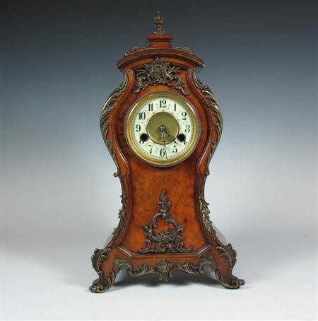 Appraisal: A late th century walnut and gilt metal mantel clock