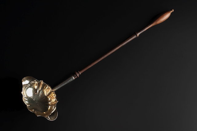 Appraisal: A SILVER PUNCH LADLE with shaped bowl and turned wooden