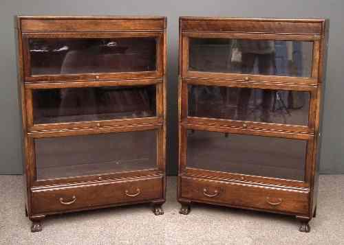 Appraisal: Two s stained wood three tier sectional bookcases with glazed