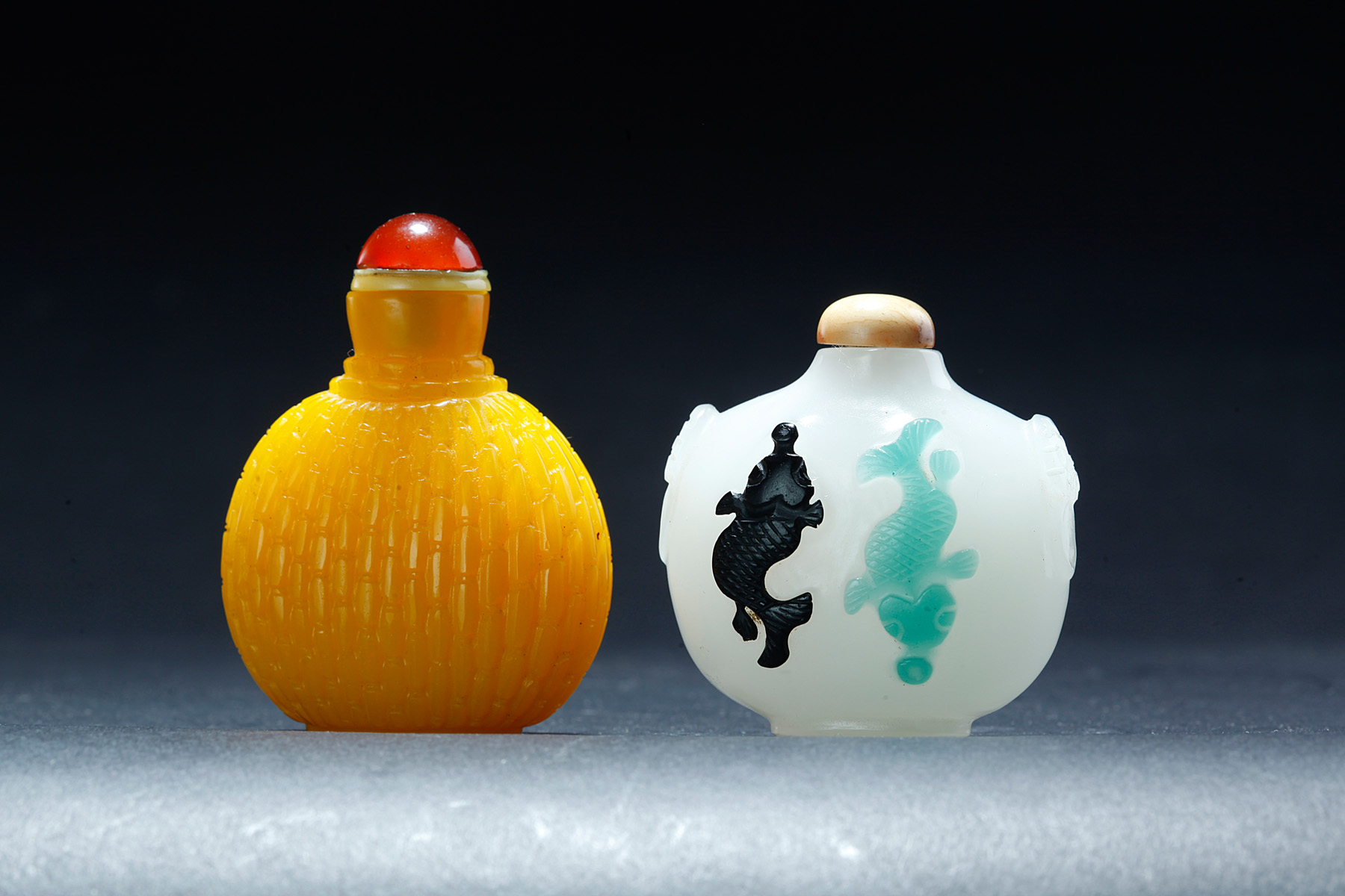 Appraisal: TWO CHINESE PEKING GLASS SNUFF BOTTLES Twentieth century Yellow with