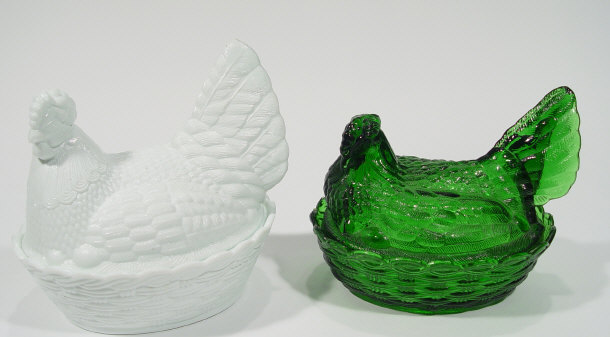 Appraisal: Two pressed glass egg baskets and covers one green the