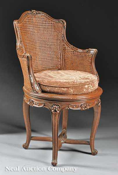 Appraisal: A Louis XV-Style Carved Walnut and Caned Chaise de Bureau